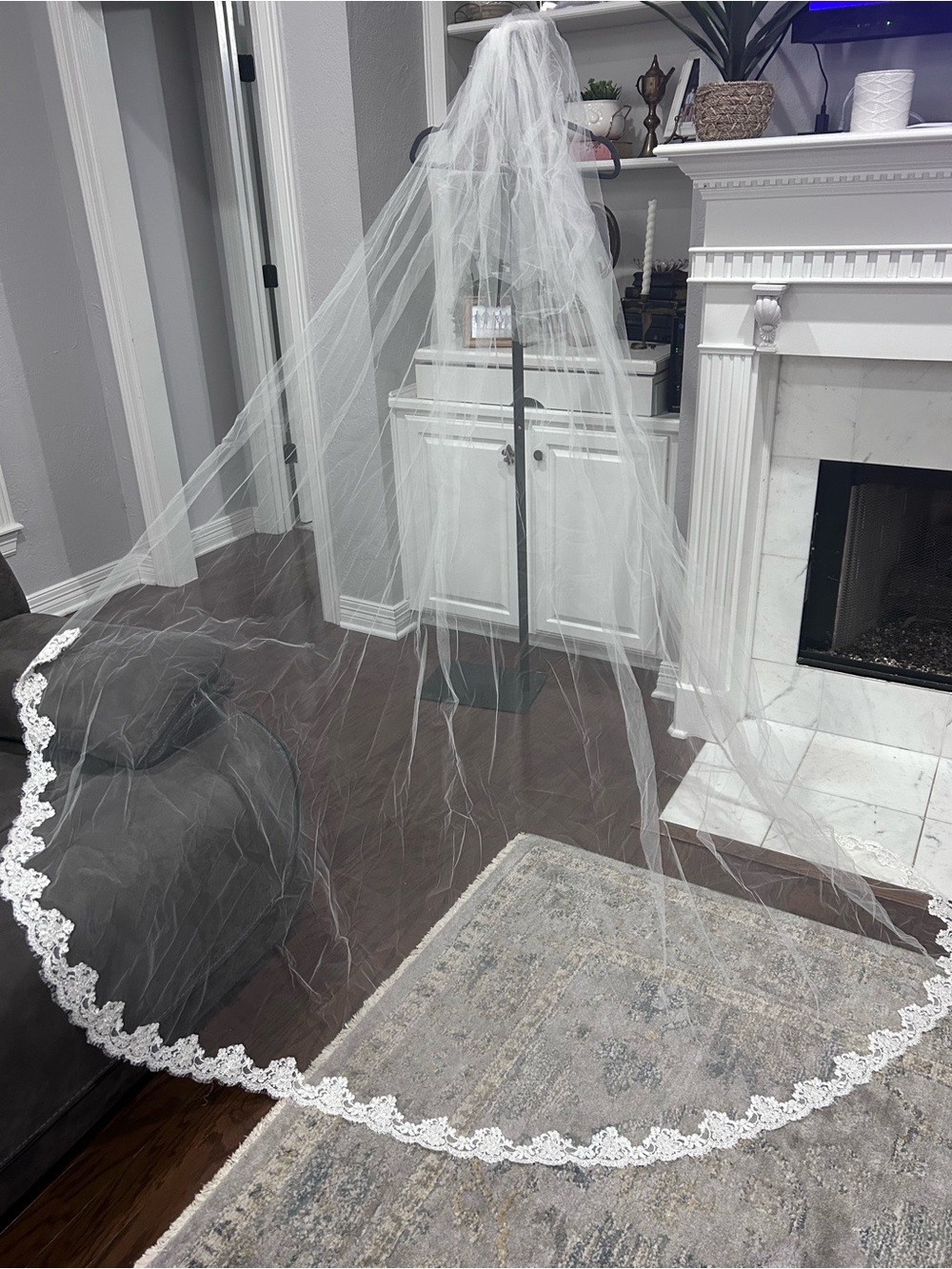sheer white cathedral-length bridal veil with a scalloped lace/pearl trim edge